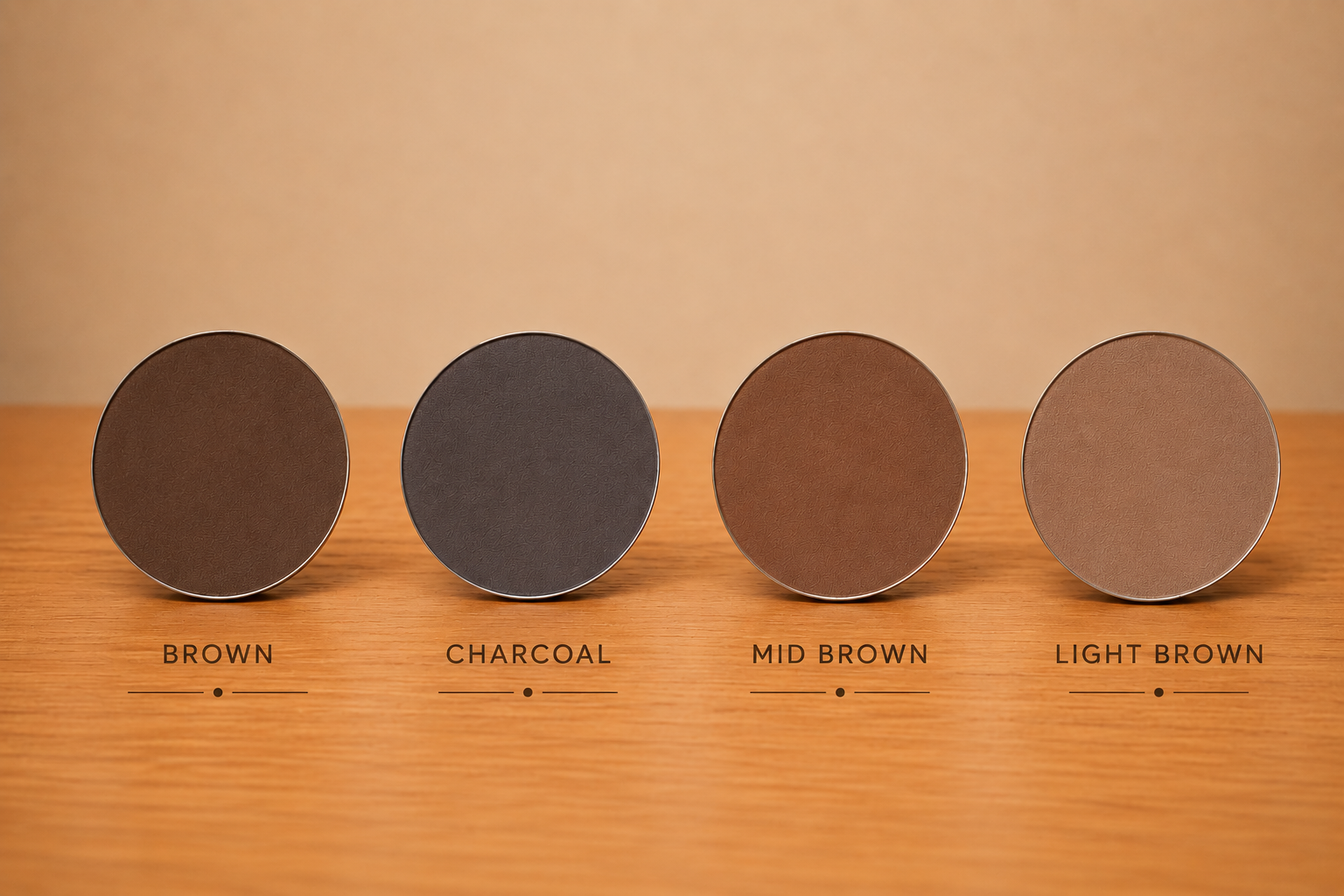Four circular brown shade samples on wooden surface